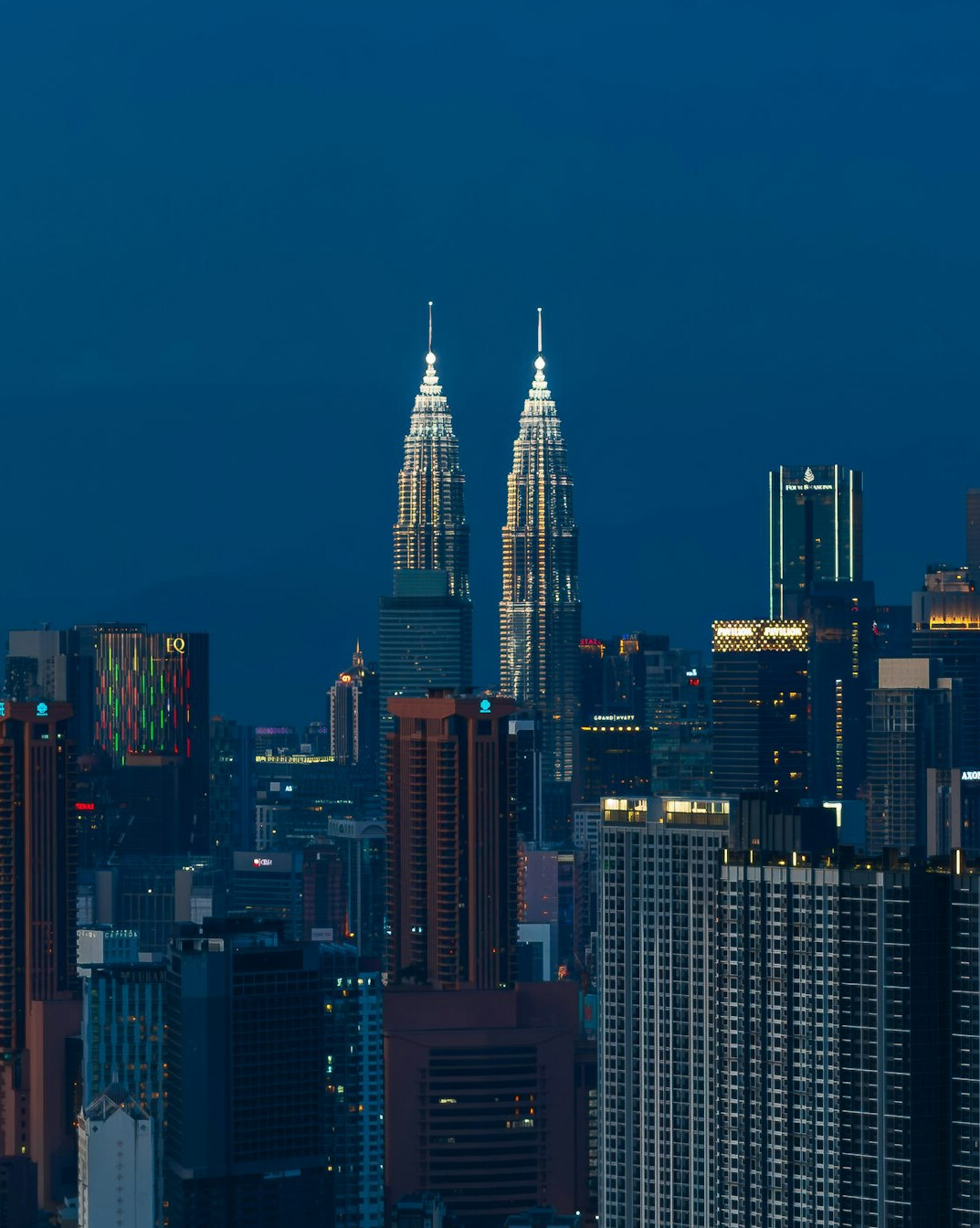 Kuala Lumpur city skyline with the Petronas Towers at dusk