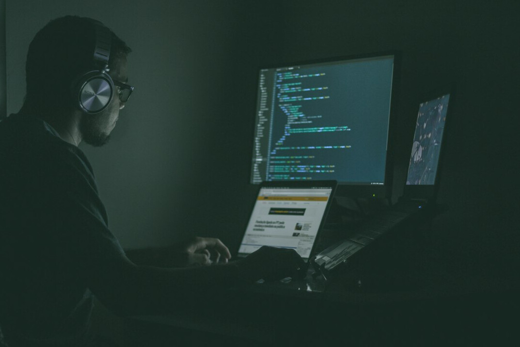 programmer writing code for insurance app